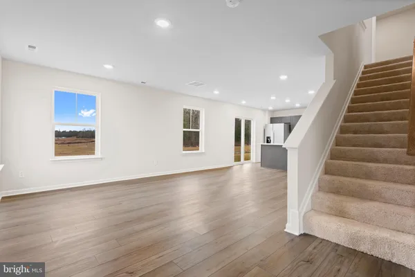 a view of an entryway with wooden floor