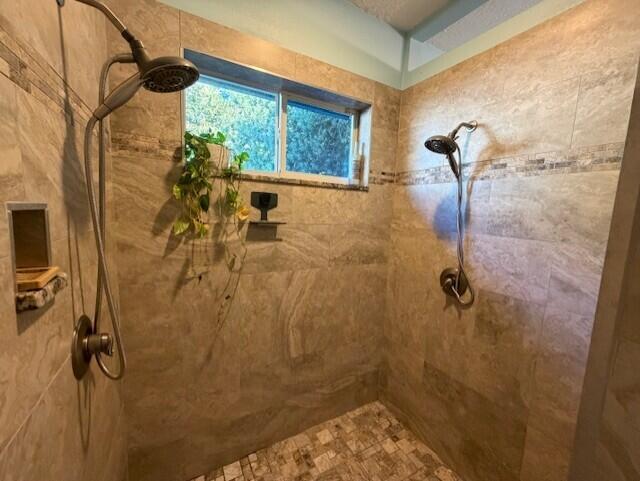 11666 Southwest Meadowlark Circle Stuart, FL 34997 - Photo 17 of 40 a bathroom with a shower