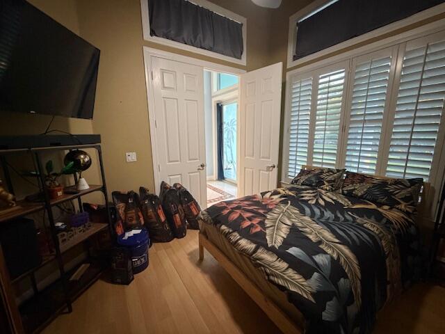 11666 Southwest Meadowlark Circle Stuart, FL 34997 - Photo 35 of 40 a bed sitting in a bedroom next to a window