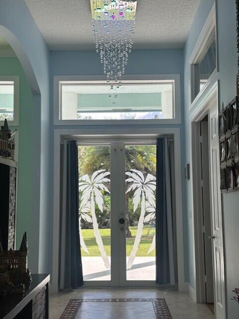 11666 Southwest Meadowlark Circle Stuart, FL 34997 - Photo 5 of 40 a view of hall way with wooden floor and a dining room