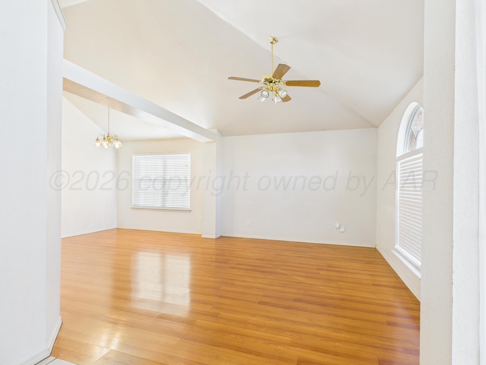 1111 Pikes Peak Drive Amarillo, TX 79110 - Photo 13 of 25 a view of empty room with wooden floor and fan