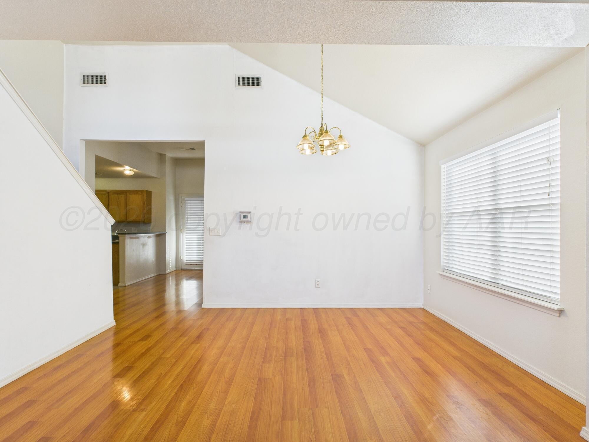 1111 Pikes Peak Drive Amarillo, TX 79110 - Photo 16 of 25 a view of empty room with wooden floor