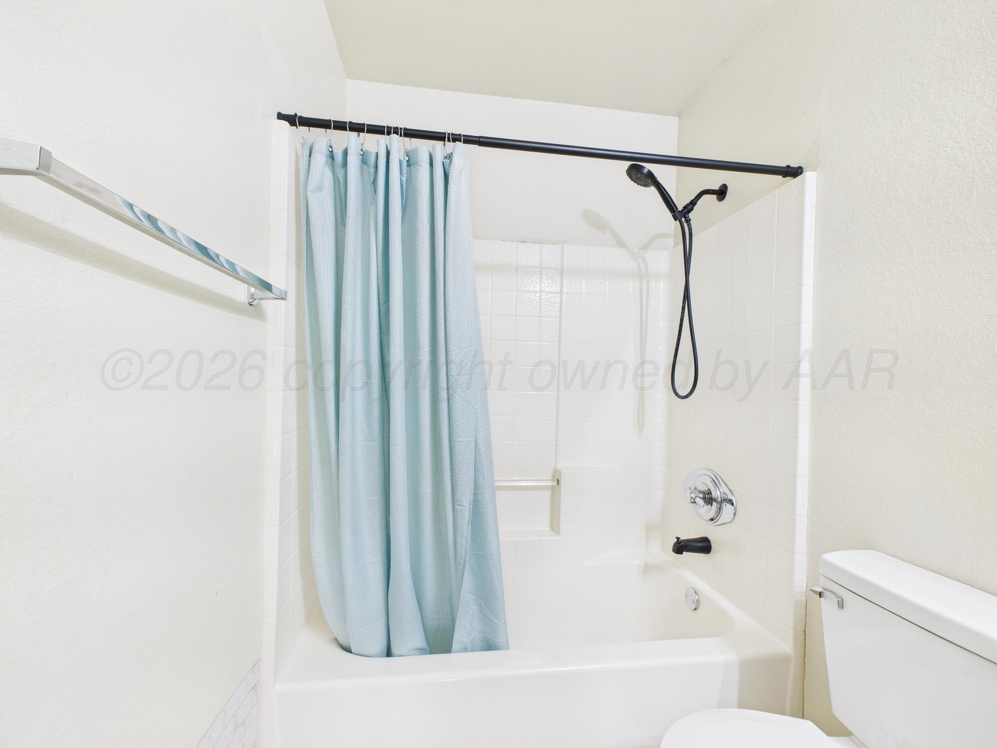 1111 Pikes Peak Drive Amarillo, TX 79110 - Photo 20 of 25 a bathroom with a shower and a bath tub