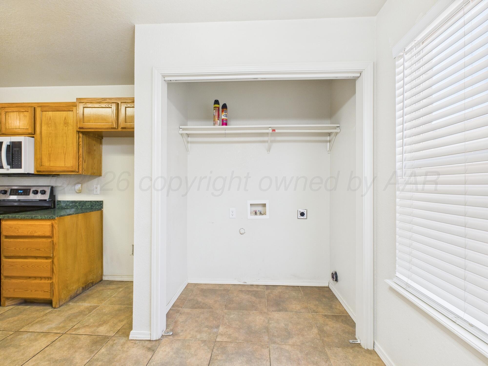 1111 Pikes Peak Drive Amarillo, TX 79110 - Photo 8 of 25 a view of kitchen with washer and dryer