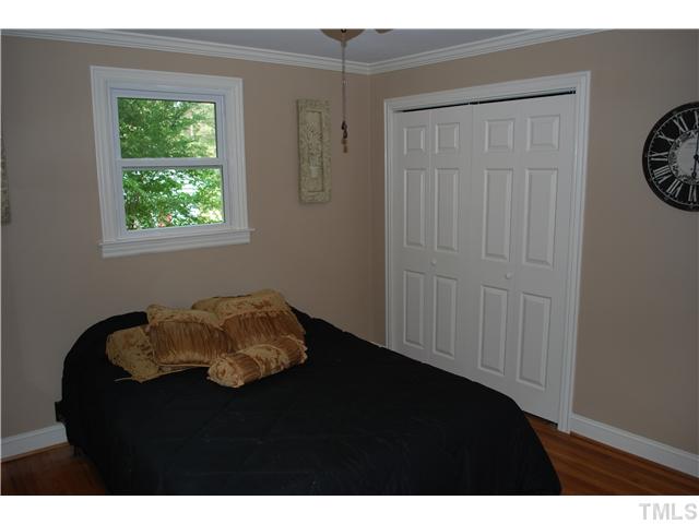 210 Quail Drive Raleigh, NC 27604 - Photo 11 of 17 a bedroom with a bed and a window