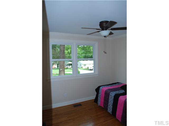 210 Quail Drive Raleigh, NC 27604 - Photo 14 of 17 a view of a room with windows and cabinet