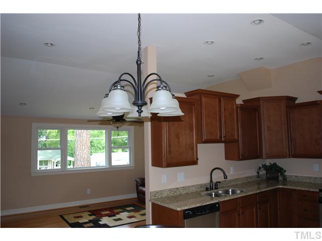 210 Quail Drive Raleigh, NC 27604 - Photo 17 of 17 a kitchen with a sink and cabinets