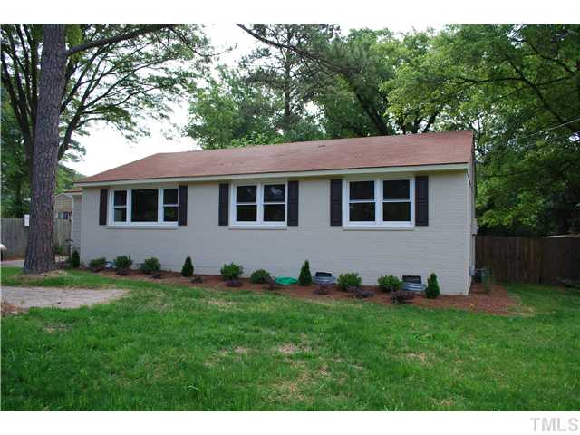 210 Quail Drive Raleigh, NC 27604 - Photo 2 of 17 a backyard of a house with lots of green space