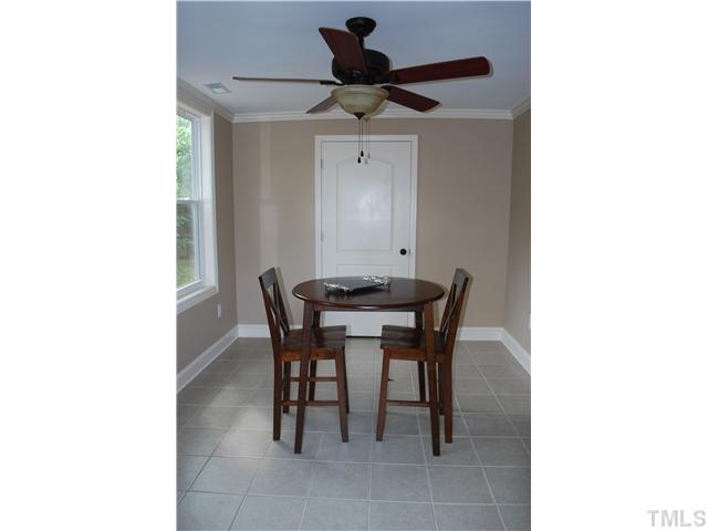 210 Quail Drive Raleigh, NC 27604 - Photo 5 of 17 a dining room with furniture and a chandelier fan