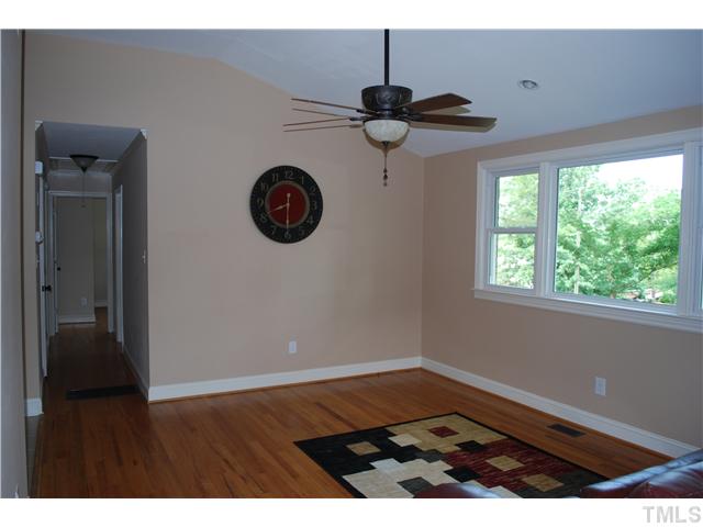 210 Quail Drive Raleigh, NC 27604 - Photo 6 of 17 a view of an empty room with a window