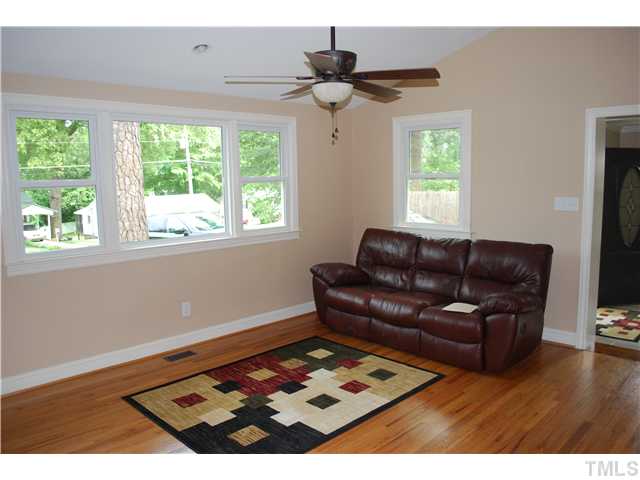 210 Quail Drive Raleigh, NC 27604 - Photo 7 of 17 a living room with furniture and a window