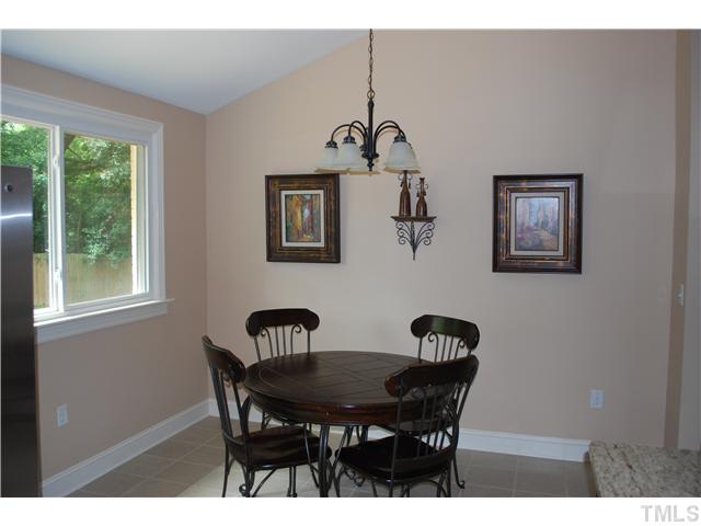 210 Quail Drive Raleigh, NC 27604 - Photo 10 of 17 a view of a dining room with furniture and window
