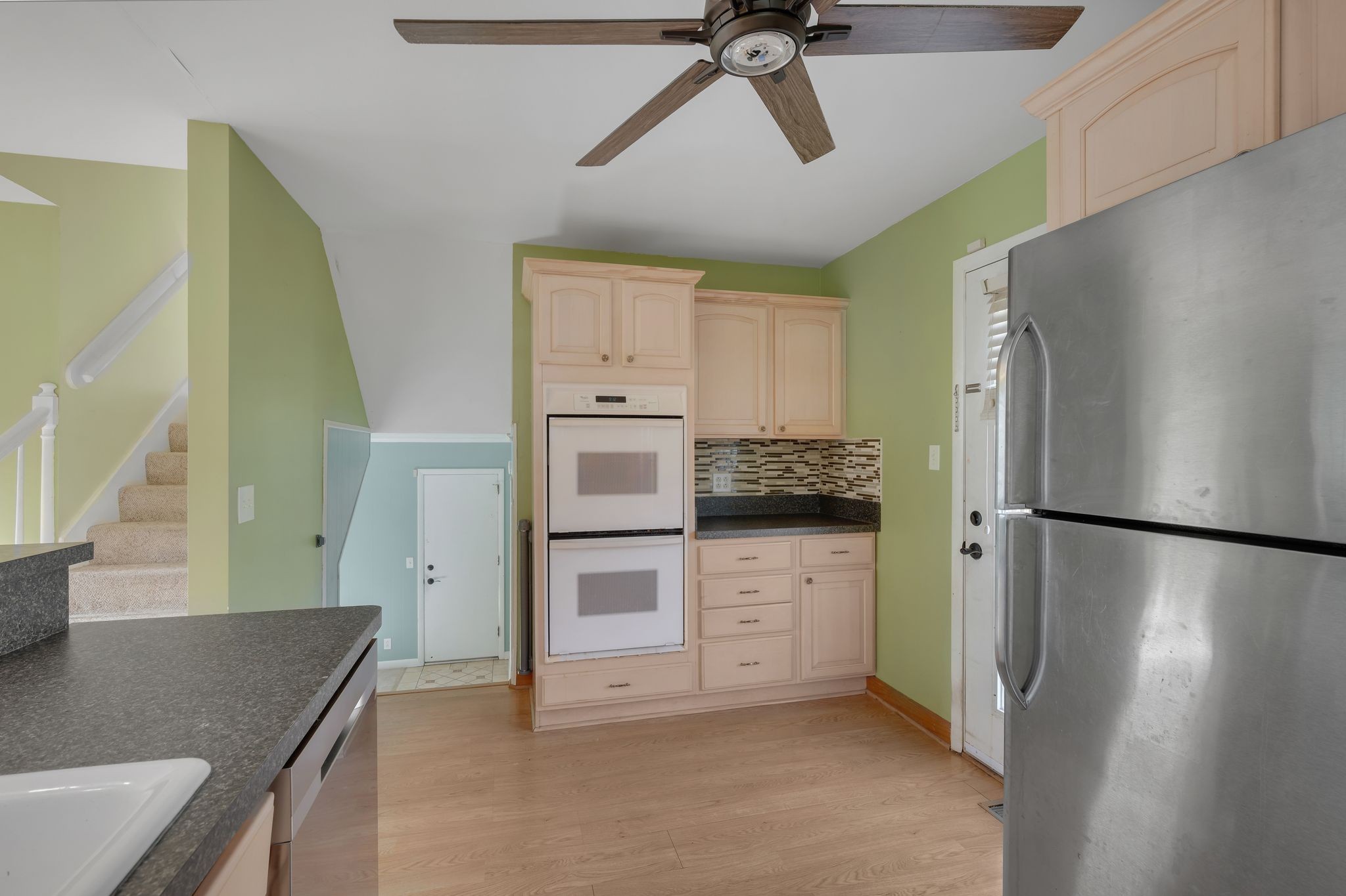 135 Grenadier Drive Franklin, TN 37064 - Photo 11 of 27 a kitchen with a refrigerator a sink and dishwasher