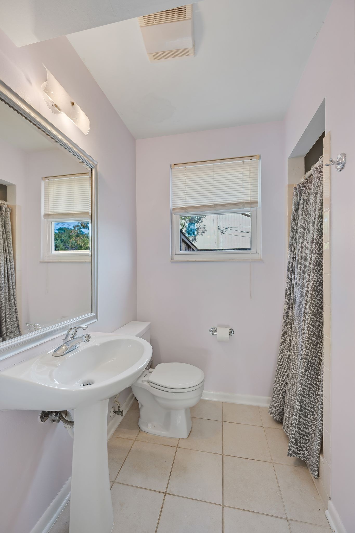 135 Grenadier Drive Franklin, TN 37064 - Photo 14 of 27 a bathroom with a sink a toilet and a mirror