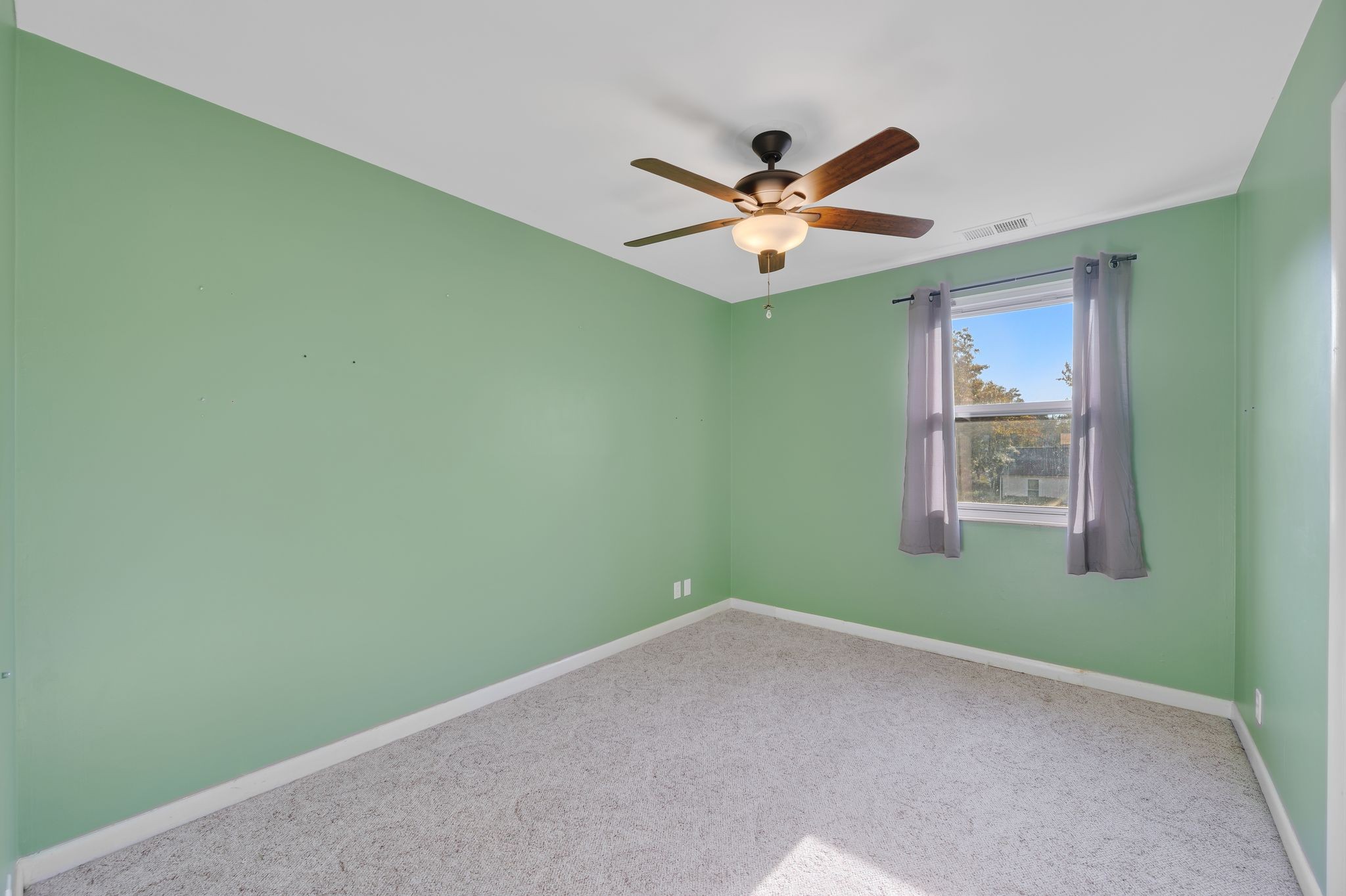 135 Grenadier Drive Franklin, TN 37064 - Photo 15 of 27 a view of a room with a fan and a window