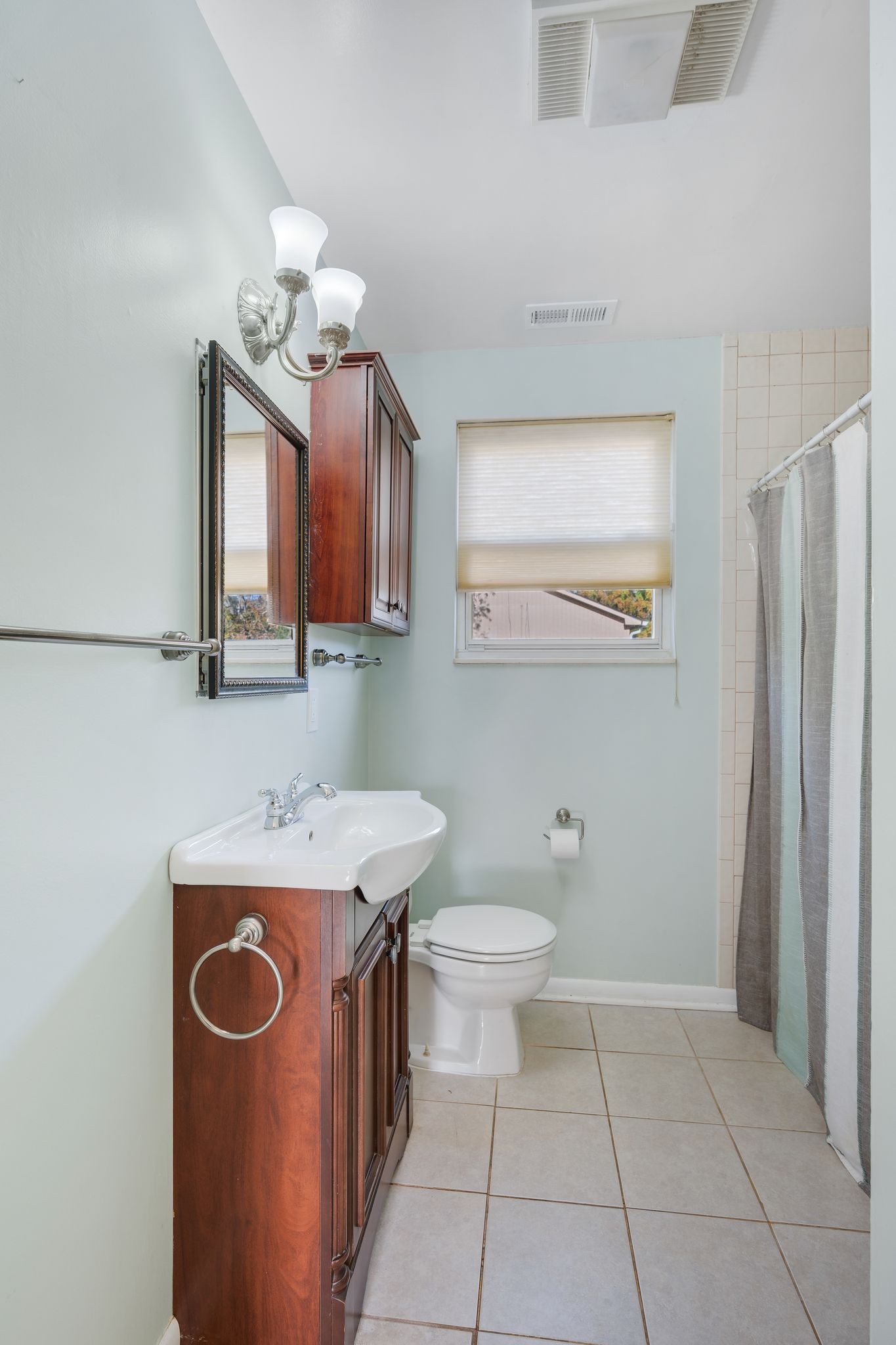 135 Grenadier Drive Franklin, TN 37064 - Photo 16 of 27 a bathroom with a sink a toilet and mirror