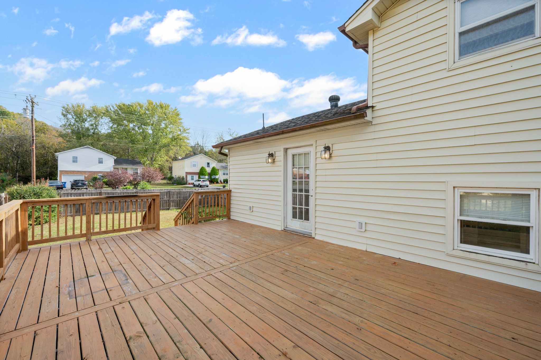 135 Grenadier Drive Franklin, TN 37064 - Photo 23 of 27 a view of a rooftop deck with wooden floor and fence