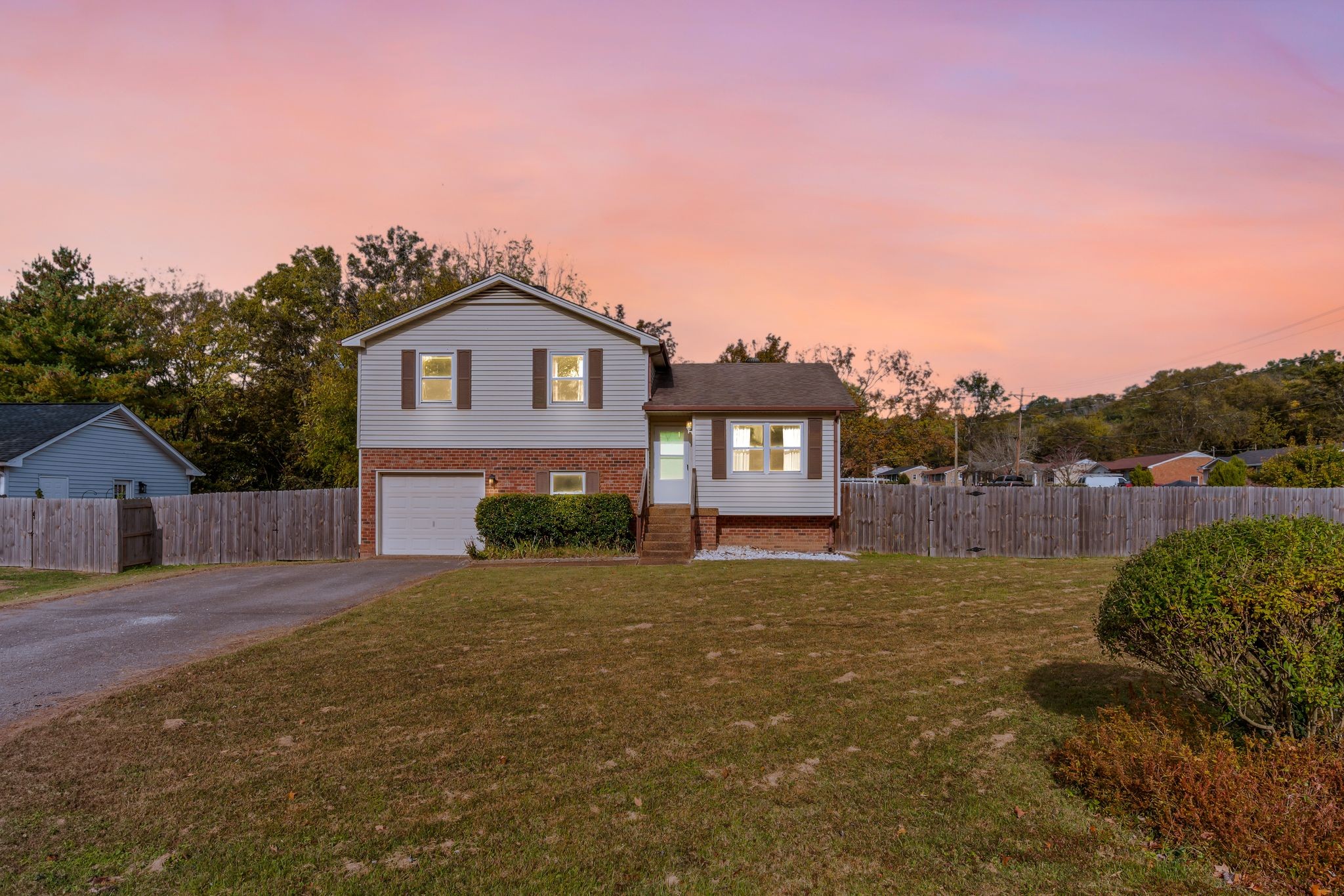 135 Grenadier Drive Franklin, TN 37064 - Photo 27 of 27 a front view of a house with a yard and garage