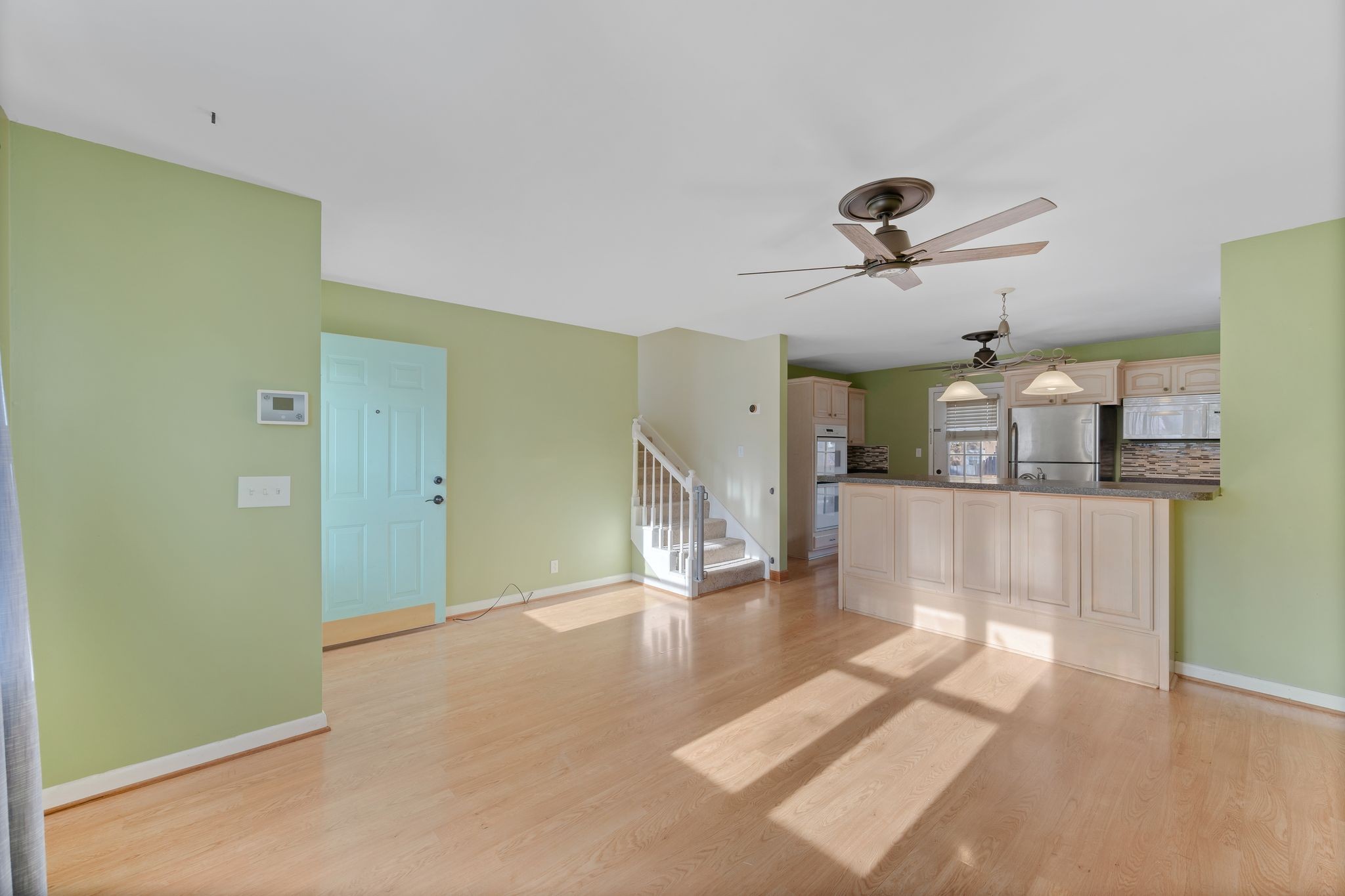 135 Grenadier Drive Franklin, TN 37064 - Photo 6 of 27 a view of a room with a ceiling fan window and a wooden floor