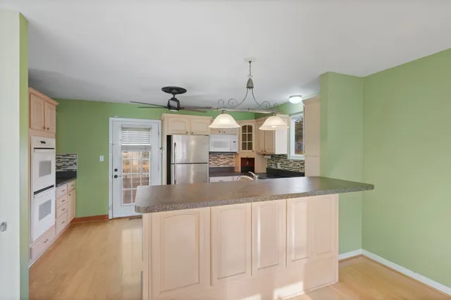 a view of a kitchen with a sink