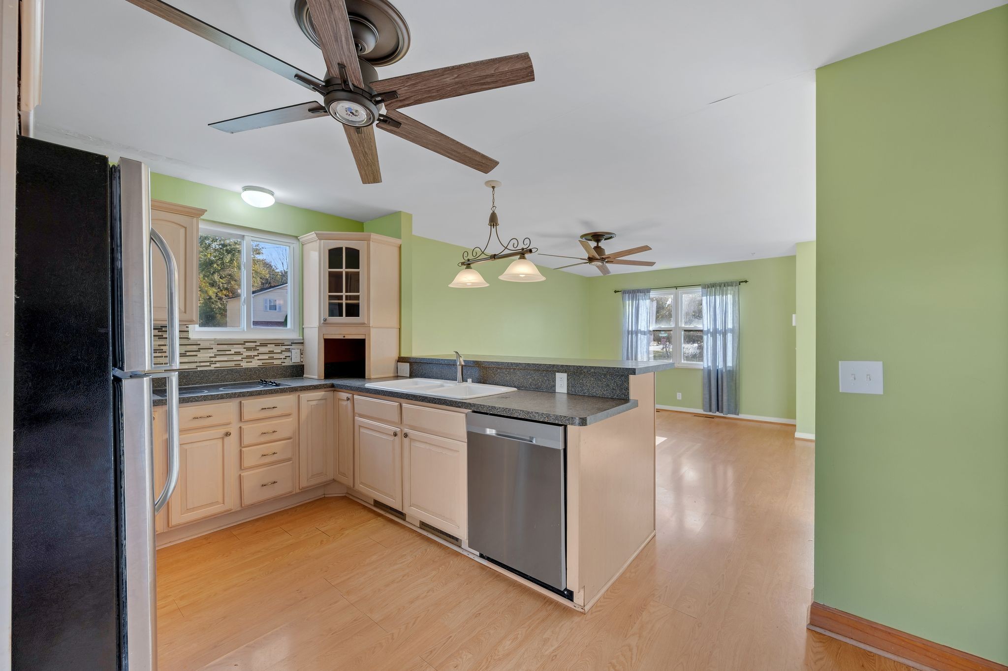 135 Grenadier Drive Franklin, TN 37064 - Photo 9 of 27 a kitchen with stainless steel appliances granite countertop a sink and cabinets