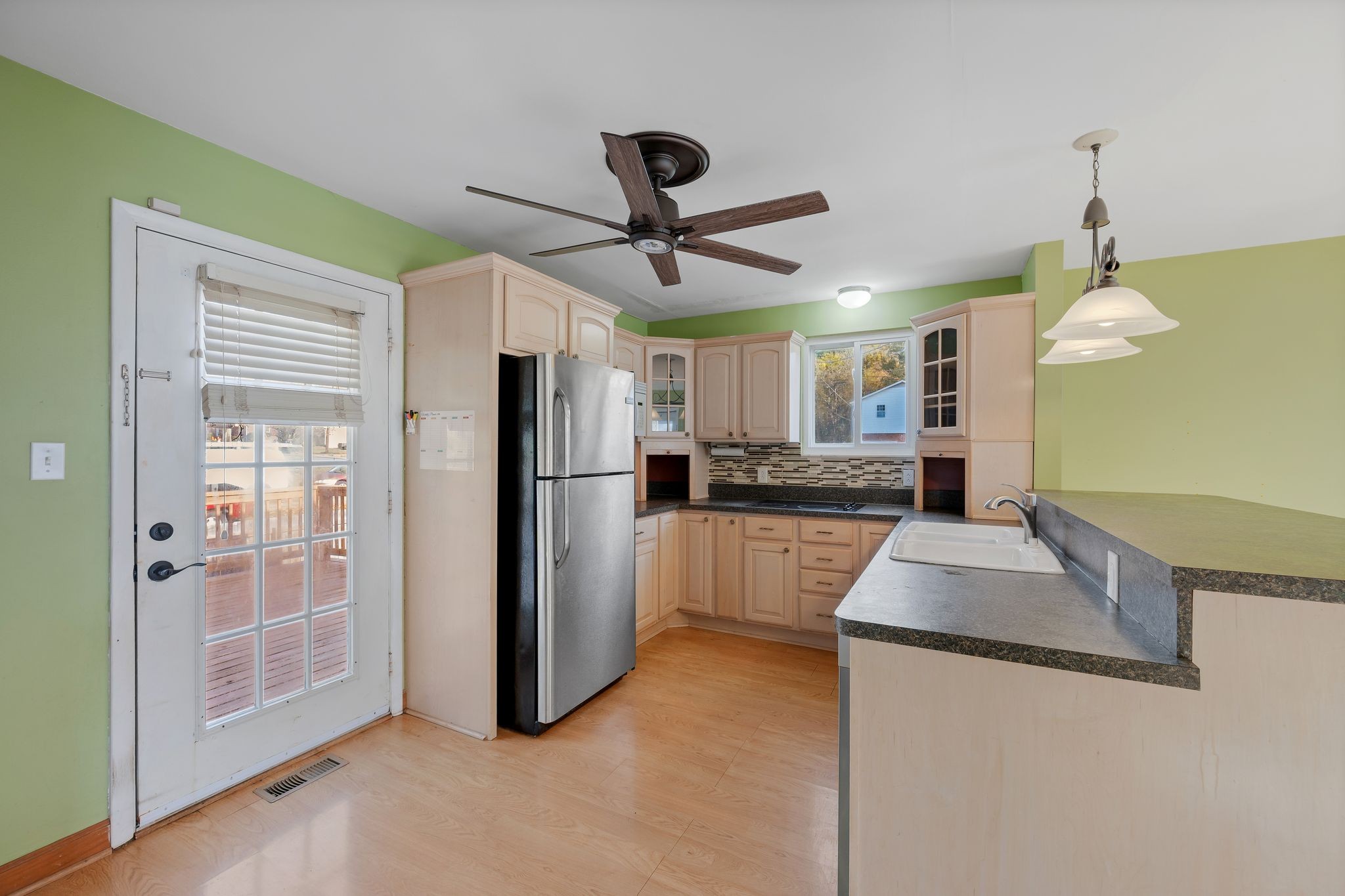 135 Grenadier Drive Franklin, TN 37064 - Photo 10 of 27 a kitchen with stainless steel appliances granite countertop a refrigerator a sink and a stove