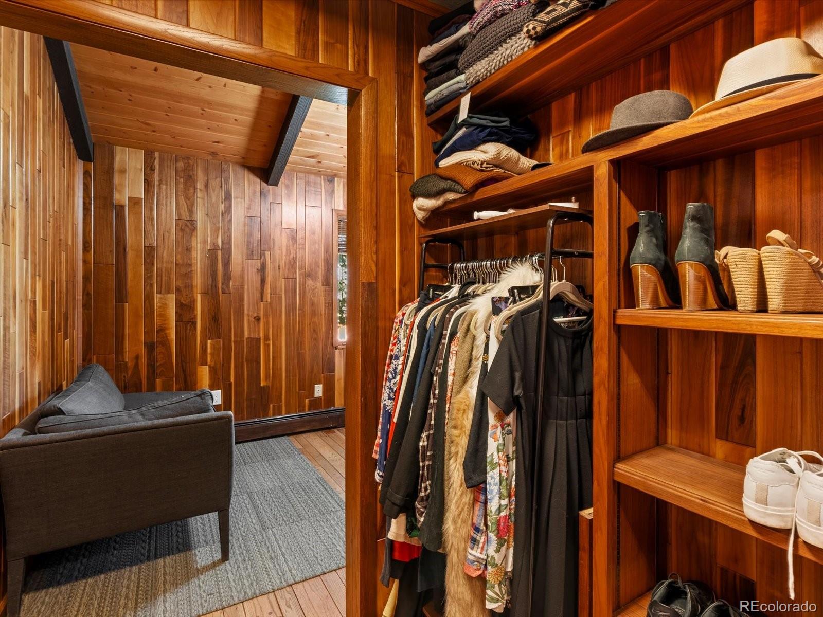 10400 West 35th Place Wheat Ridge, CO 80033 - Photo 31 of 44 a view of walk in closet with clothes and shoes