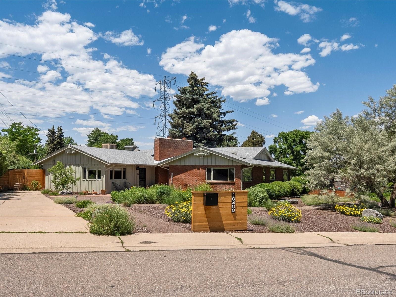 10400 West 35th Place Wheat Ridge, CO 80033 - Photo 43 of 44 a front view of a house with garden