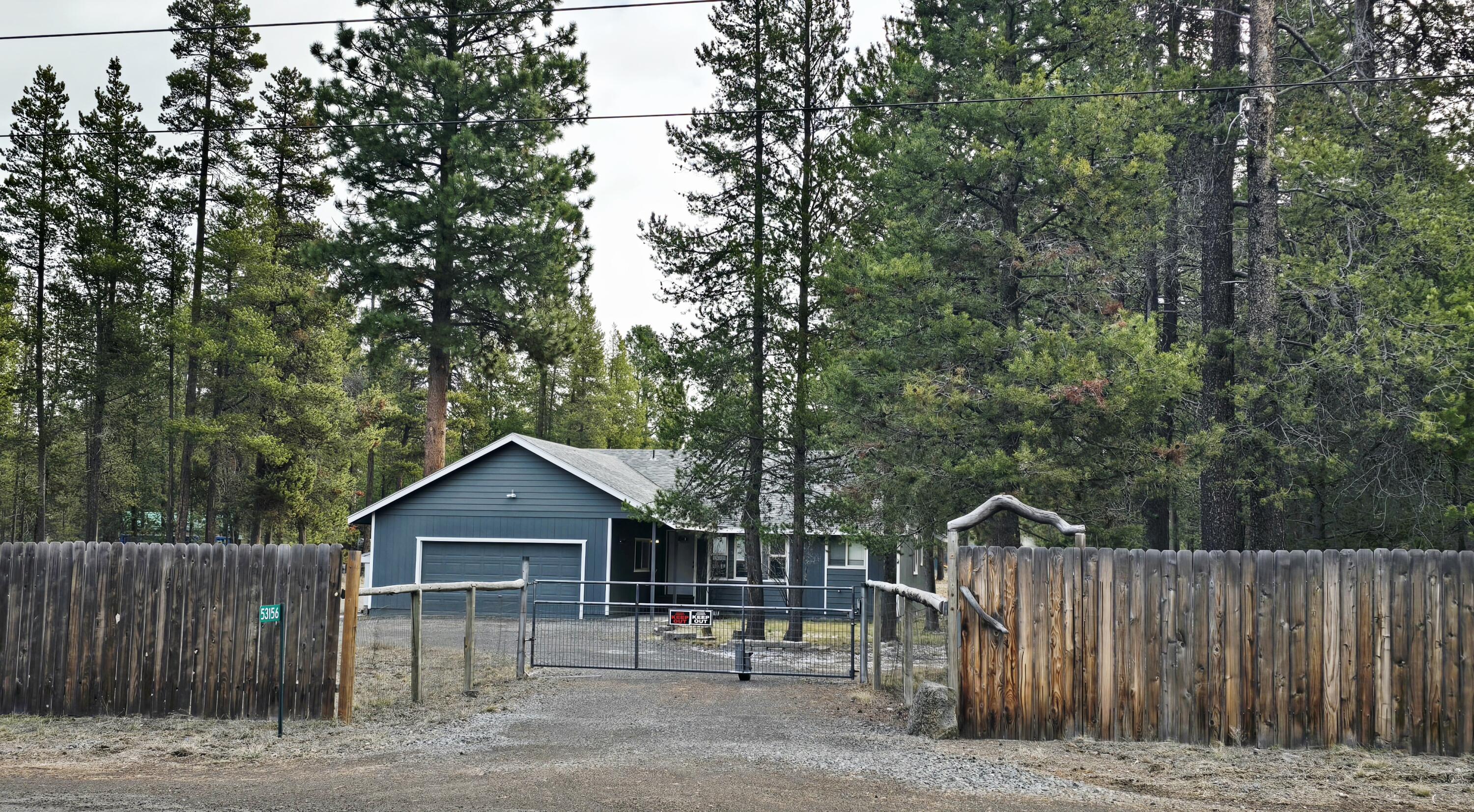 53156 Day Road La Pine, OR 97739 - Photo 5 of 28 Day Rd., street view. Privacy fence faces Day Rd.
