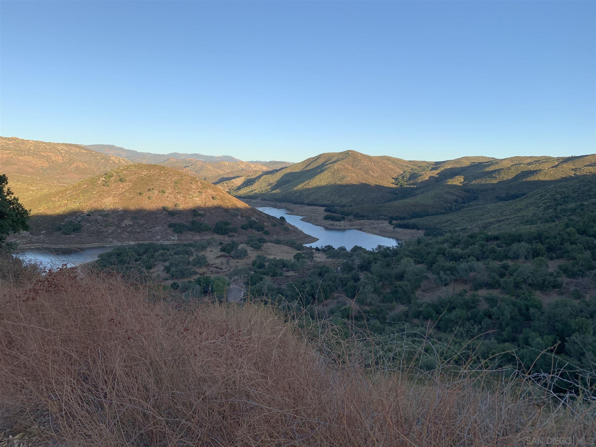 0 Sutherland Dam Road Ramona, CA 92065 - Photo 2 of 5 a view of a mountain range with a lush green forest