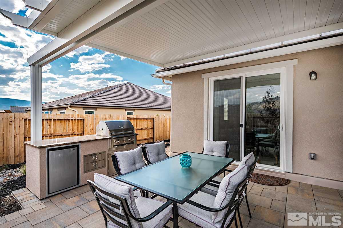 3020 Bull Rider Drive Reno, NV 89521 - Photo 24 of 25 a view of a patio with table and chairs