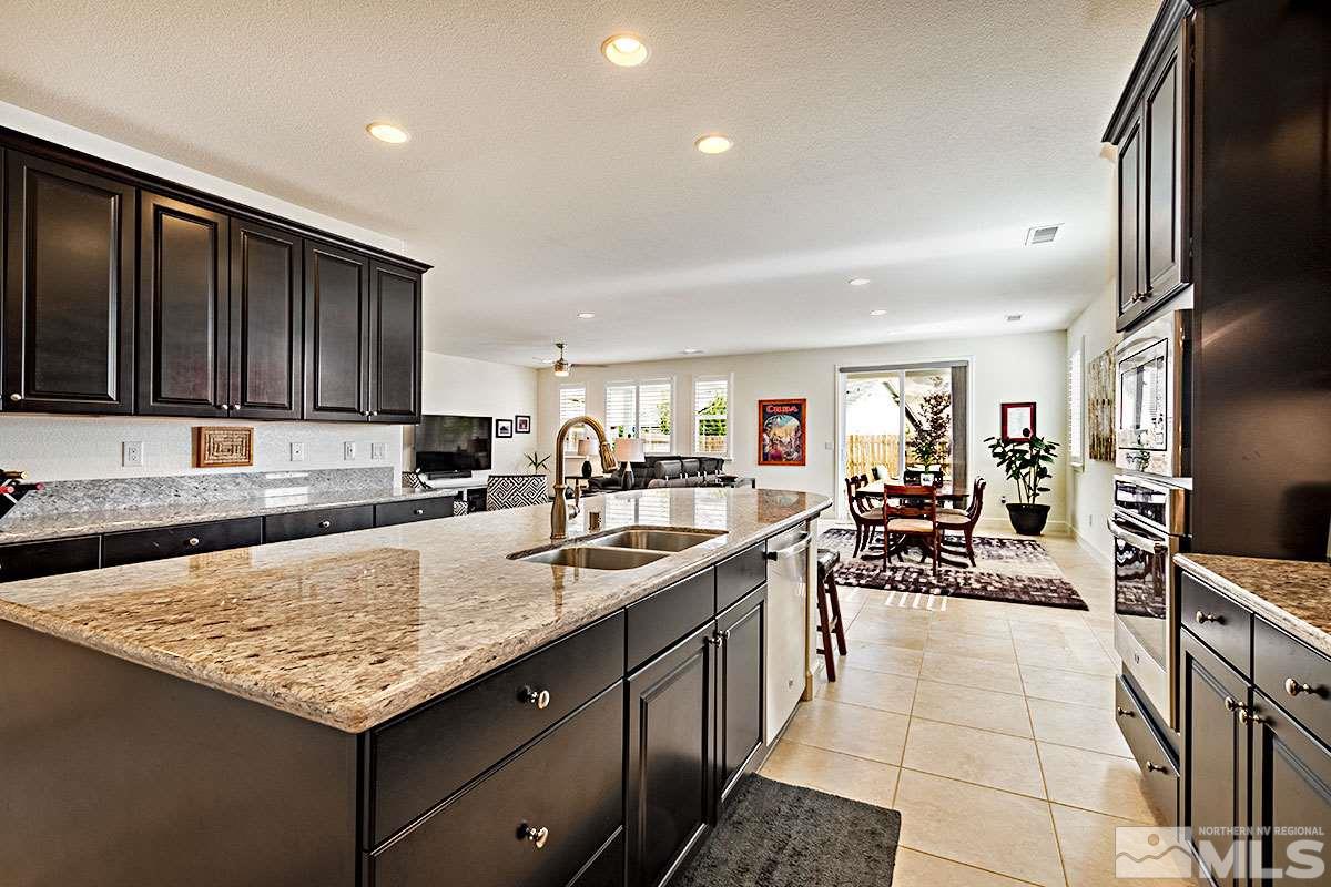 3020 Bull Rider Drive Reno, NV 89521 - Photo 4 of 25 a kitchen with counter top space cabinets and stainless steel appliances
