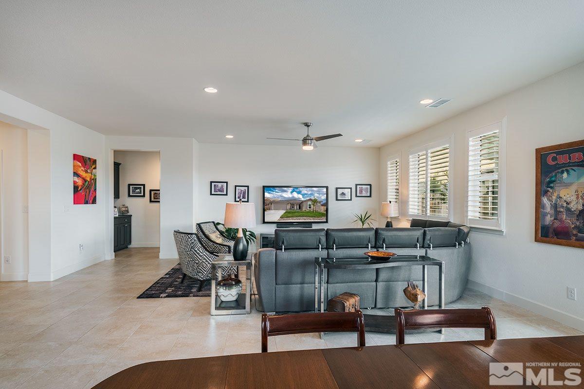3020 Bull Rider Drive Reno, NV 89521 - Photo 8 of 25 a living room with fireplace furniture and a flat screen tv