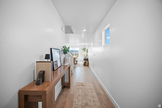 2123 Wolverine Way, Unit 2437 Washington, UT 84780 - Photo 13 of 40 Entryway featuring wood-finish flooring, white walls, and a rectangular window providing natural light