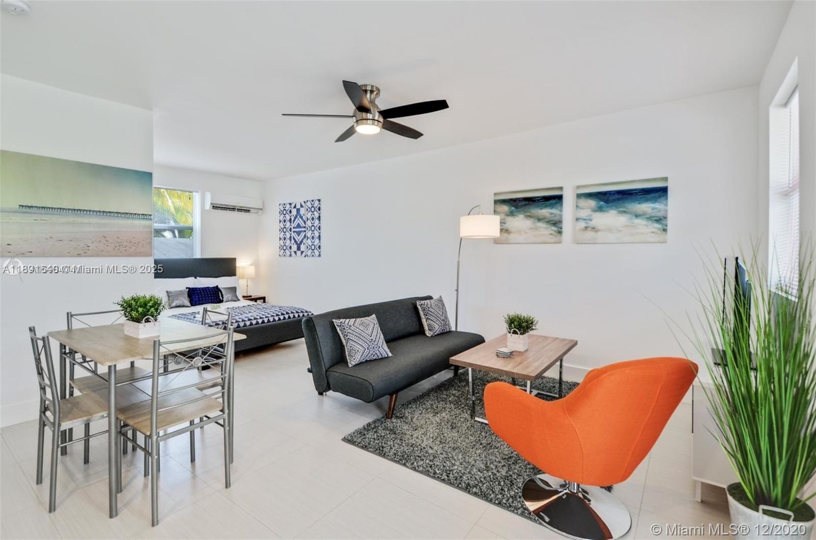 2601 Northwest 1st Avenue, Unit 6 Miami, FL 33127 - Photo 4 of 11 a living room with furniture and a potted plant