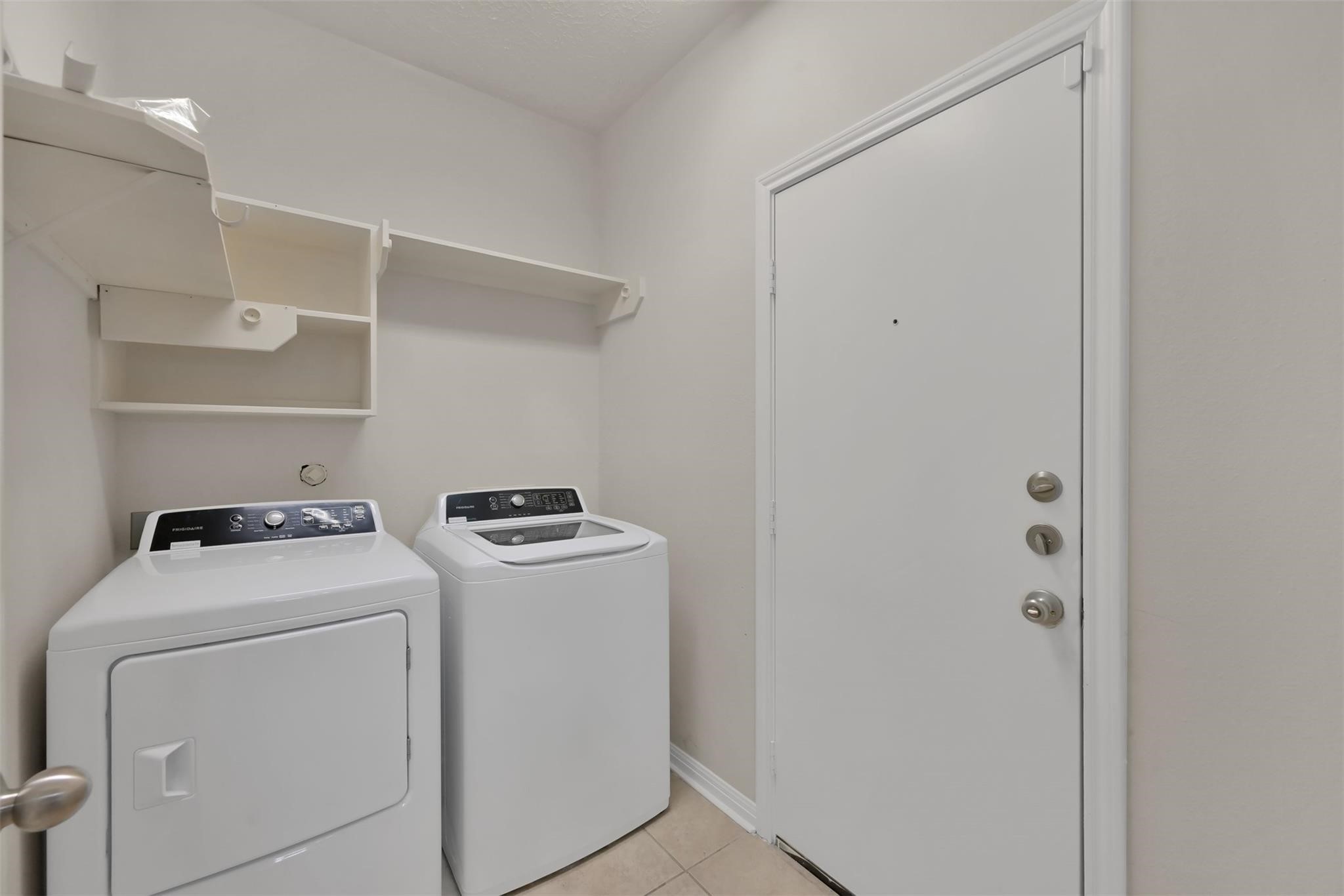 1443 Meadowhigh Lane Spring, TX 77373 - Photo 20 of 23 a utility room with dryer and washer