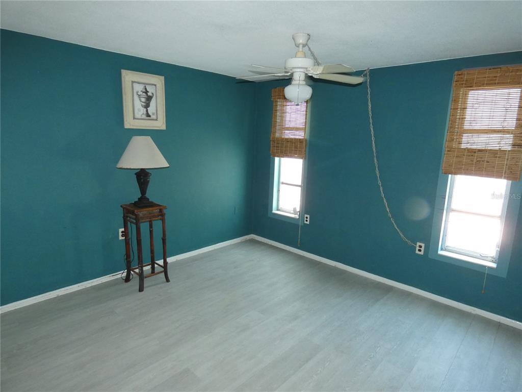 13618 Stacey Drive Hudson, FL 34667 - Photo 13 of 34 a view of an empty room with a window