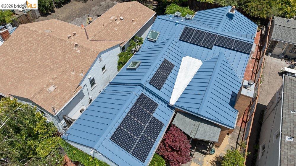 287 Purdue Avenue Kensington, CA 94708 - Photo 58 of 60 Blue metal standing seam roof with multiple skylights and integrated solar panels