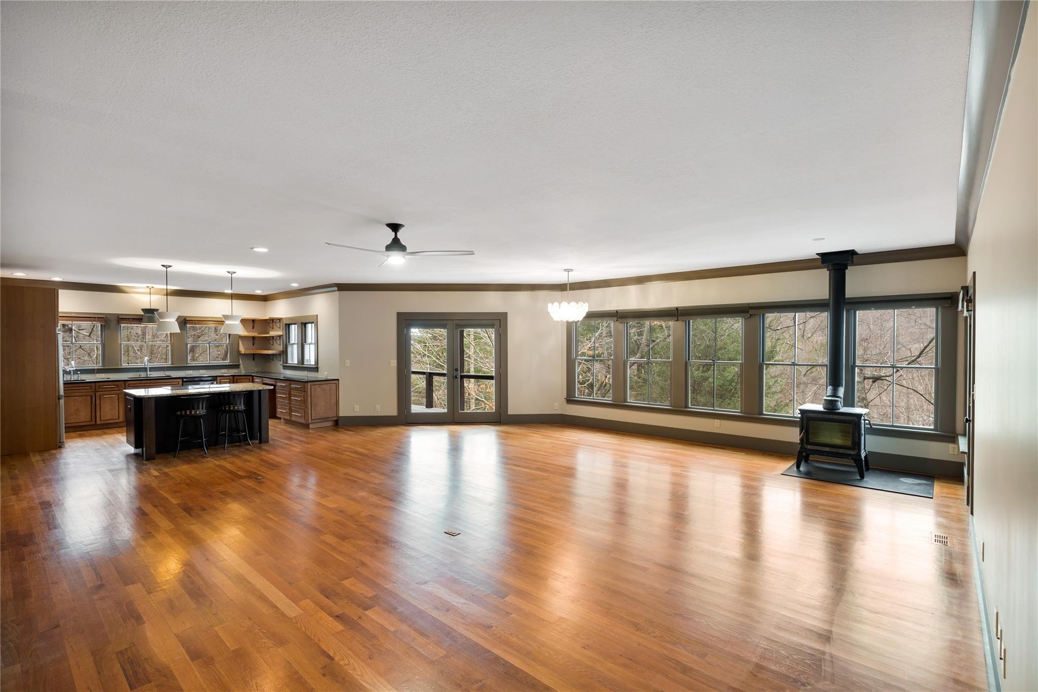 23 Ruffed Grouse Drive Weaverville, NC 28787 - Photo 13 of 48 a view of an empty room with window and wooden floor