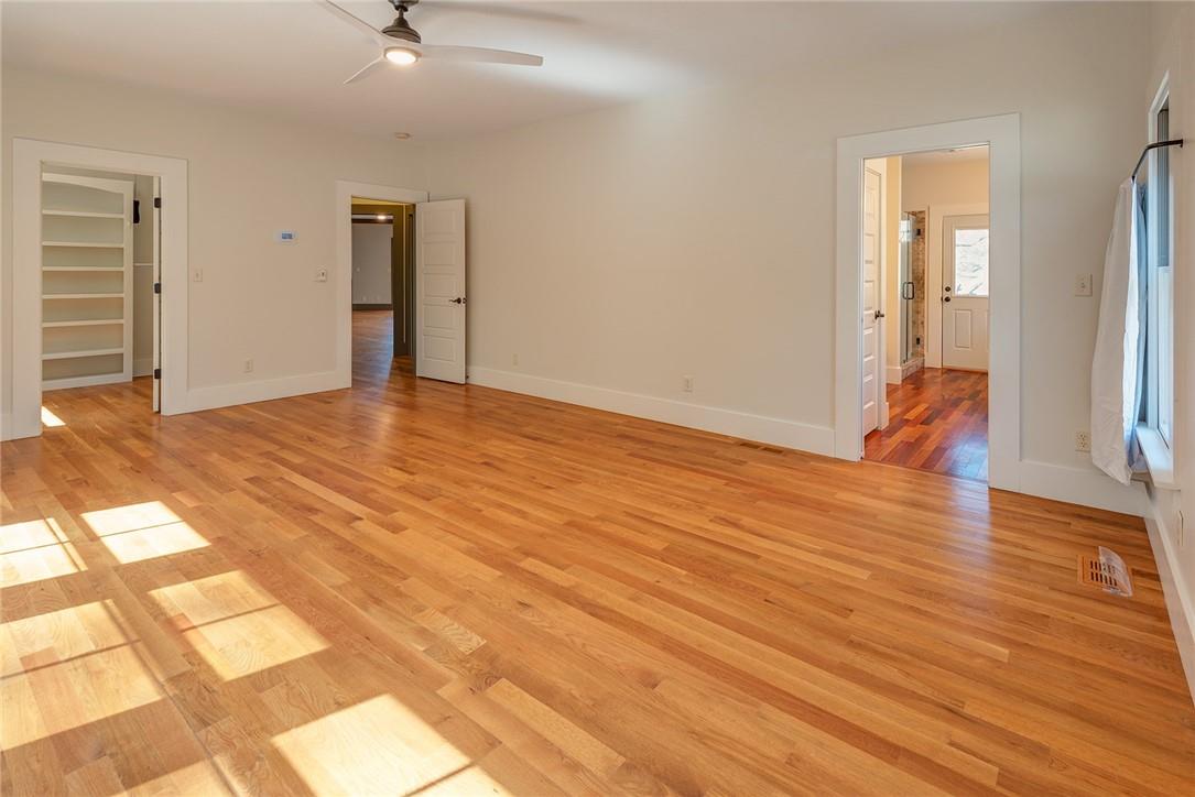 23 Ruffed Grouse Drive Weaverville, NC 28787 - Photo 21 of 48 a view of an empty room with wooden floor and a window