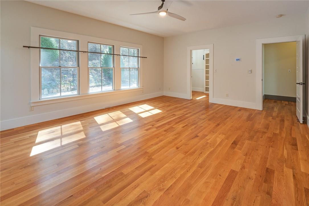23 Ruffed Grouse Drive Weaverville, NC 28787 - Photo 22 of 48 an empty room with wooden floor and windows