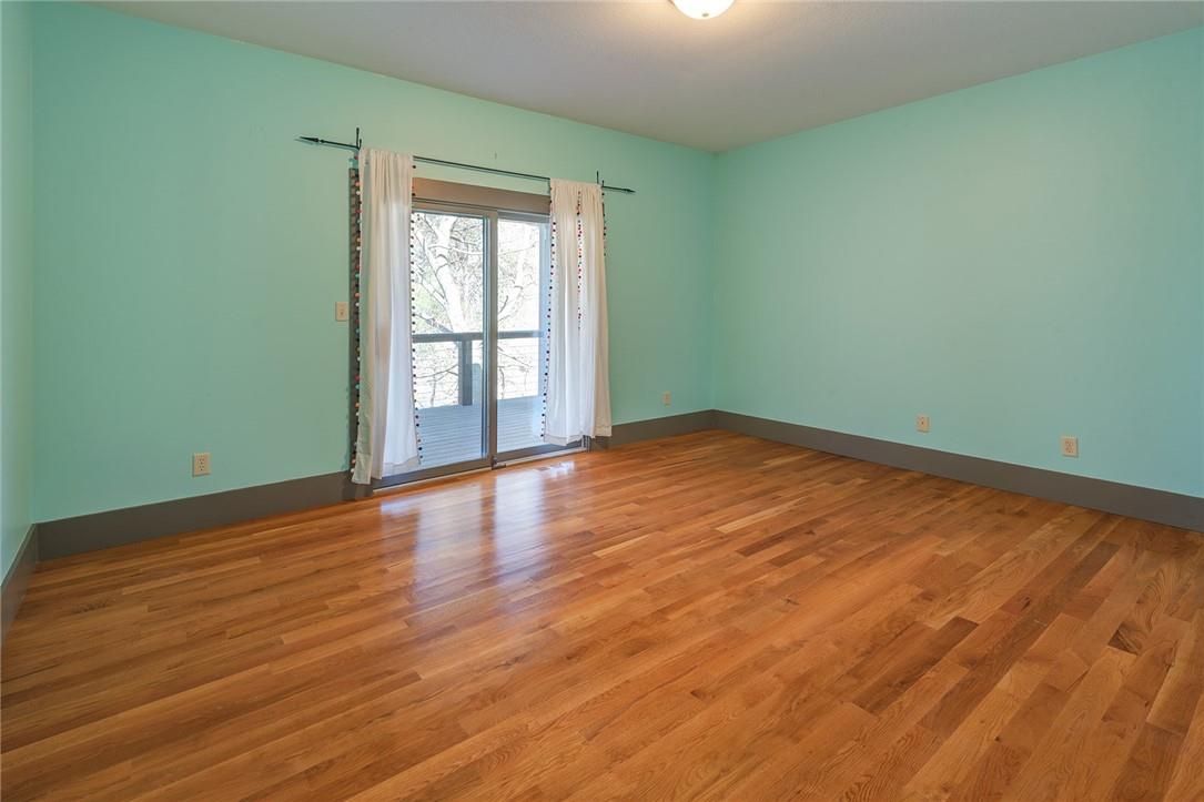 23 Ruffed Grouse Drive Weaverville, NC 28787 - Photo 26 of 48 an empty room with wooden floor and windows