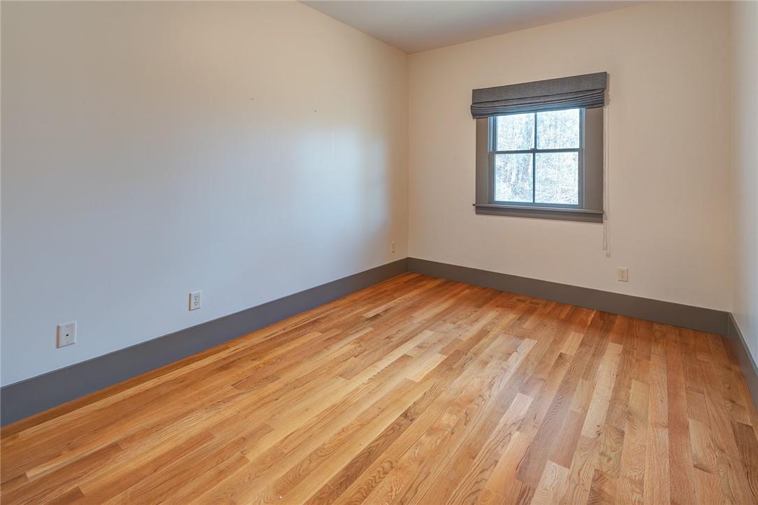23 Ruffed Grouse Drive Weaverville, NC 28787 - Photo 28 of 48 a view of empty room with wooden floor and fan