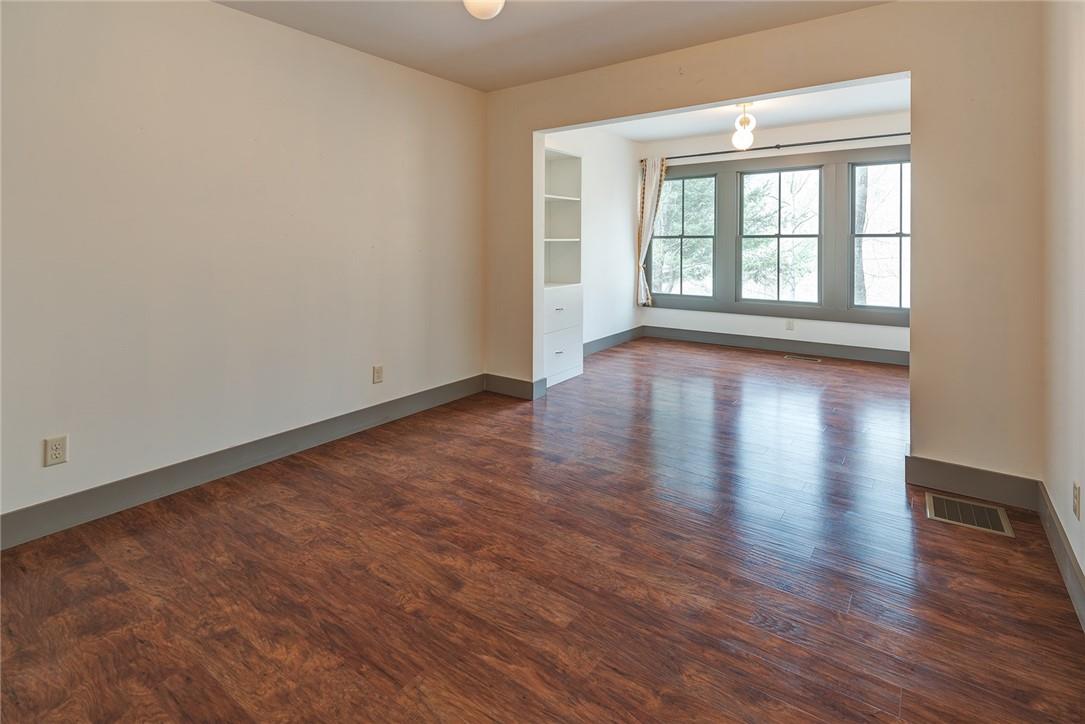 23 Ruffed Grouse Drive Weaverville, NC 28787 - Photo 33 of 48 a view of an empty room with wooden floor and a window