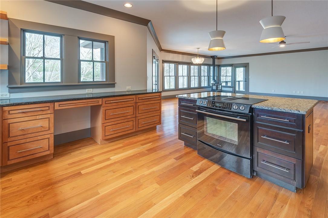 23 Ruffed Grouse Drive Weaverville, NC 28787 - Photo 9 of 48 a kitchen with stainless steel appliances granite countertop a stove a sink and a refrigerator