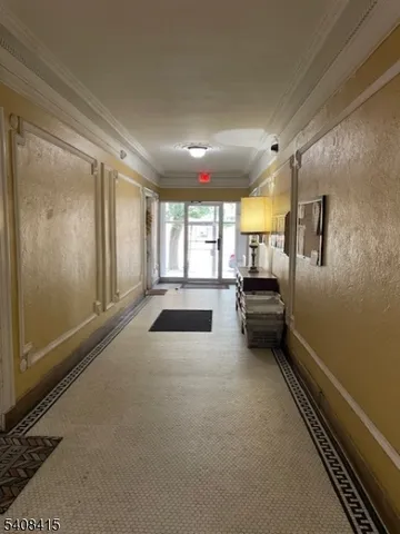 a kitchen with sink and refrigerator