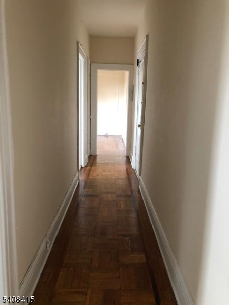 16 Seymour Street, Unit 21 Montclair, NJ 07042 - Photo 5 of 6 a view of a hallway with a door