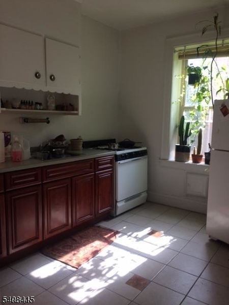16 Seymour Street, Unit 21 Montclair, NJ 07042 - Photo 6 of 6 a kitchen with stainless steel appliances granite countertop a sink a stove and a refrigerator