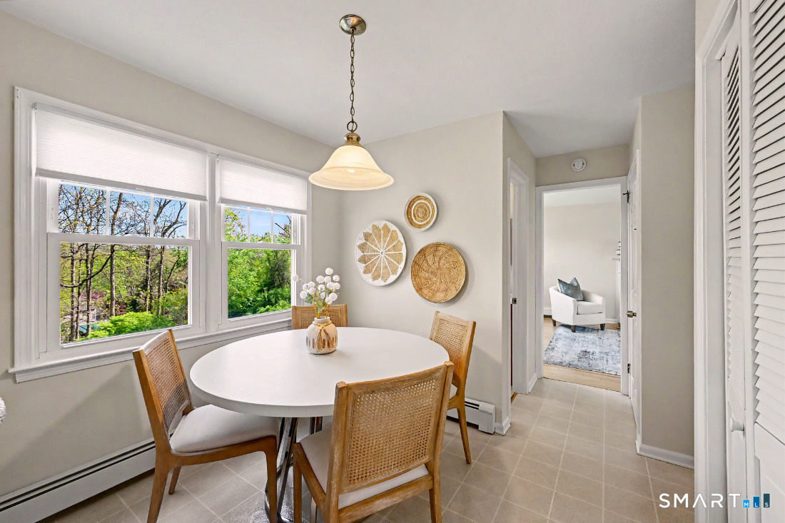 370 Nepas Road Fairfield, CT 06825 - Photo 14 of 32 a view of a dining room and a table chair in a room