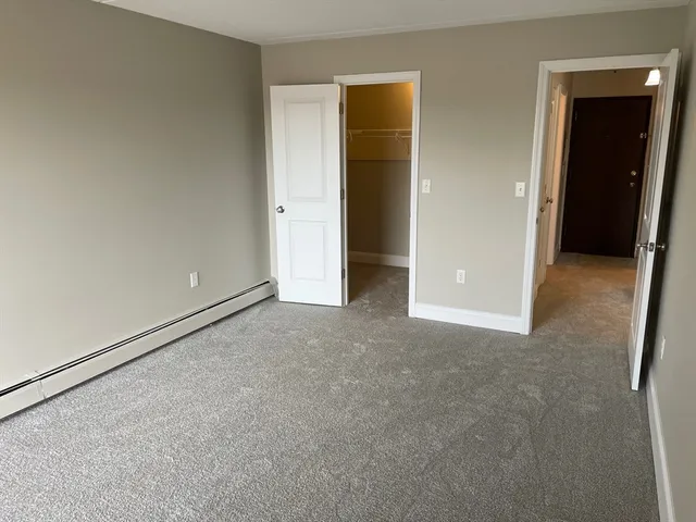 an empty room with closet area